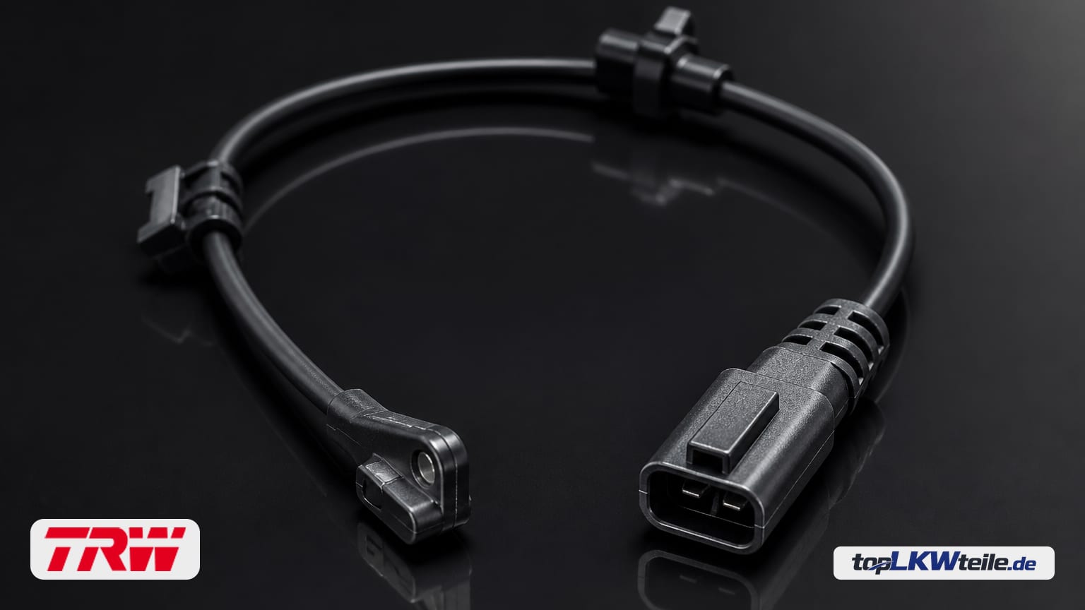 TRW brake pad wear sensor on a dark reflective surface with soft rim light: black cable, plug connector, and slim sensor head in a premium studio look.
